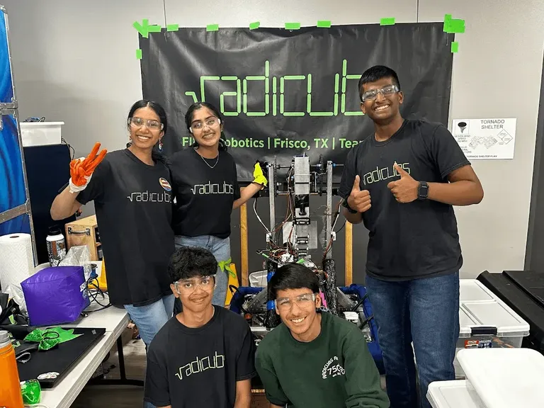 Radicubs members with their robot at an outreach booth